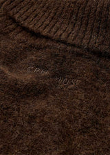 https://acorns.dk/cdn/shop/files/packshot_2_211598_2129_Details2_1_CMRYLIA-PULLOVER_20Mulch.jpg?v=1785924079